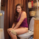 A brunette girl rushes to the toilet, sits down and takes a loose-sounding shit while wearing shorts. Presented in 720P HD video. About 3 minutes.